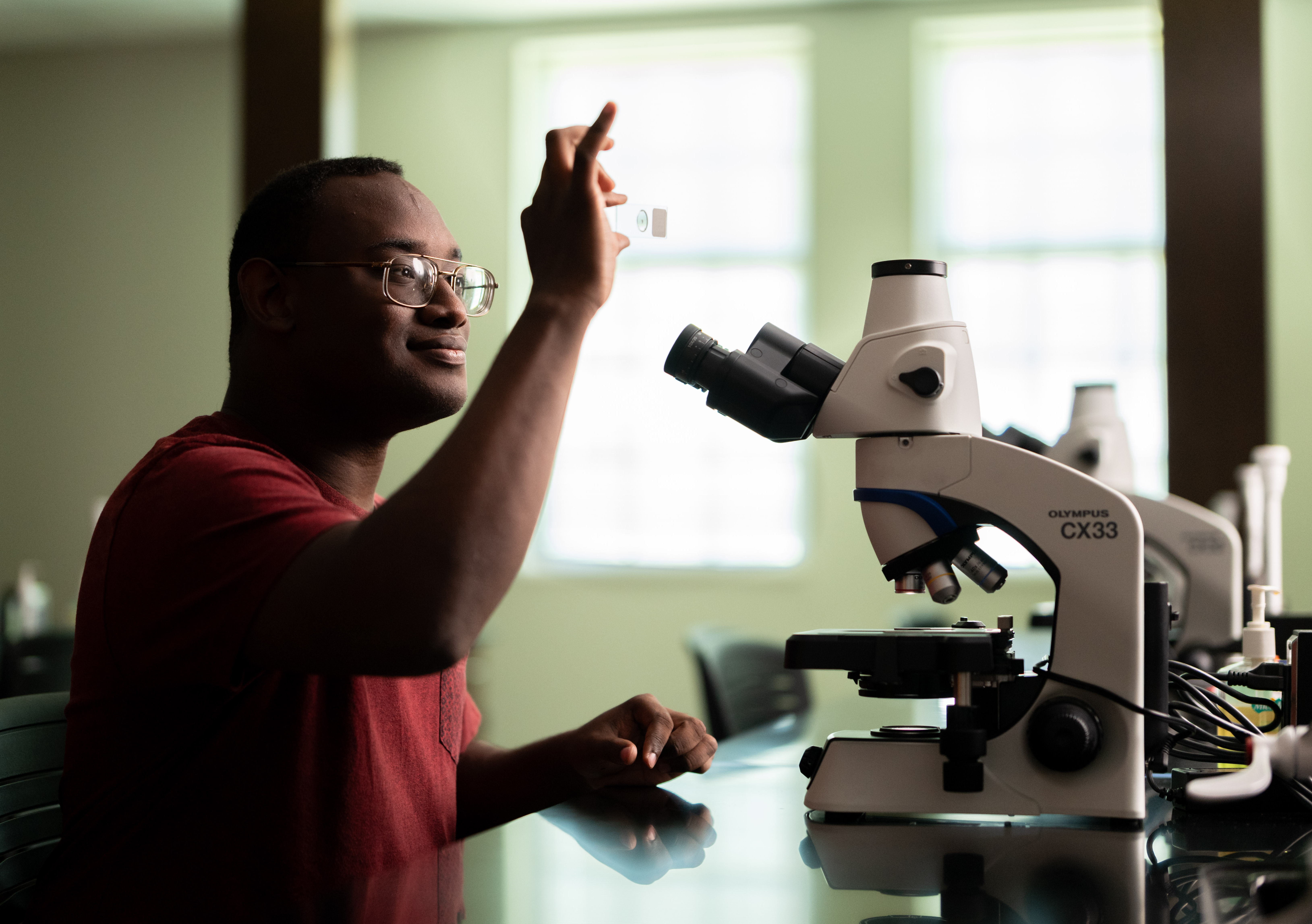 Students in lab with large machines